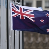 The New Zealand flag flutters outside Parliament buildings in Wellington in Wellington on October 29, 2014.  New Zealand will hold a binding referendum in 2016 on changing the national flag, with Prime Minister John Key hoping to drop the current design featuring Britain's Union Jack in favour of a silver fern.   AFP PHOTO / MARTY MELVILLE        (Photo credit should read Marty Melville/AFP/Getty Images)