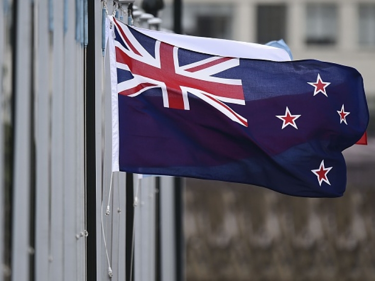 The New Zealand flag flutters outside Parliament buildings in Wellington in Wellington on October 29, 2014.  New Zealand will hold a binding referendum in 2016 on changing the national flag, with Prime Minister John Key hoping to drop the current design featuring Britain's Union Jack in favour of a silver fern.   AFP PHOTO / MARTY MELVILLE        (Photo credit should read Marty Melville/AFP/Getty Images)